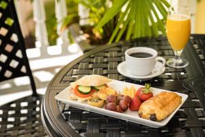 a plate of food on a table with a cup of coffee at Indigo Inn in Charleston