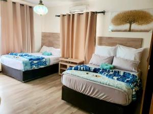 Ένα ή περισσότερα κρεβάτια σε δωμάτιο στο Orient Guest House