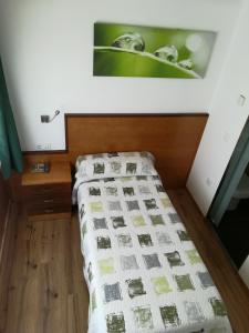 Postel nebo postele na pokoji v ubytování La Muralla