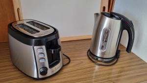 a toaster and coffee maker sitting on a counter at Apartment Heidi in Spiez