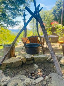 a pot sitting on top of a pile of rocks at Yurta con uso piscina e vista meravigliosa in Dicomano