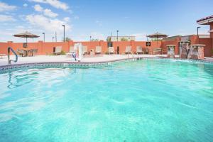 a large swimming pool in a hotel at Homewood Suites by Hilton Yuma in Yuma