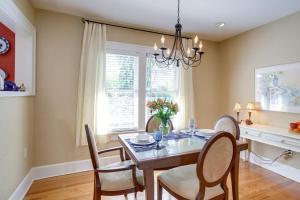 a dining room with a table and chairs and a window at Charming St Petersburg Bungalow 2 Mi to Downtown! in St Petersburg