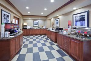 a large room with a hair salon with a checkerboard floor at Hampton Inn & Suites Toledo-Perrysburg in Rossford