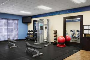 a gym with dumbbells and weights in a room at Hampton Inn & Suites Tulsa South Bixby in Tulsa
