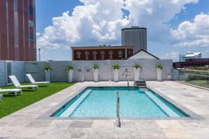 a swimming pool on the roof of a building at DoubleTree by Hilton Hotel Tallahassee in Tallahassee