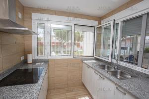 a kitchen with a sink and some windows at Adaptados 32 in Vinaròs +15 photos