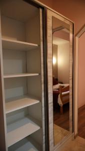 a closet with a mirror and a bedroom at Old Byurakan Gouest House in Byurakan