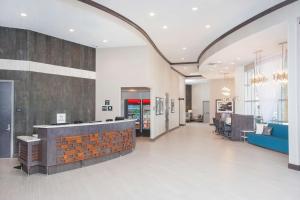 a lobby with a reception desk in a building at Hampton Inn & Suites LAX El Segundo in El Segundo