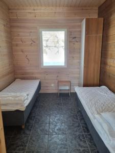 Postel nebo postele na pokoji v ubytování Villa Tumppu