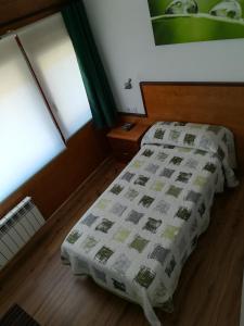 Postel nebo postele na pokoji v ubytování La Muralla