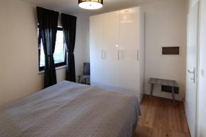 Posteľ alebo postele v izbe v ubytovaní Geräumige Ferienwohnung mit Seezugang