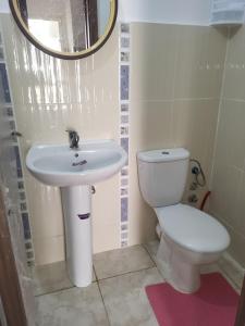 a bathroom with a sink and a toilet at Complexe tamuda doha tetouan in Tétouan +4 photos