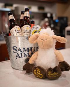 a bucket with a stuffed sheep and beer bottles at Courtyard Boston Copley Square in Boston