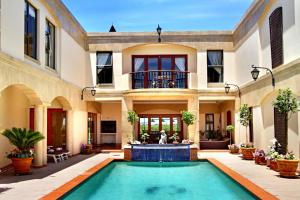 an image of a house with a swimming pool at Casa Mia Guesthouse in Table View