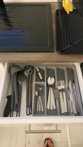 a drawer filled with utensils in a drawerasteryasteryasteryasteryasteryastery at Diamond House in Veresegyház