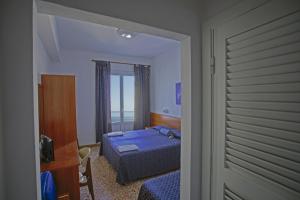Postel nebo postele na pokoji v ubytování Hotel Paradiso