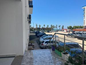 a group of cars parked in a parking lot at Joy Summer Apartment in Skataj