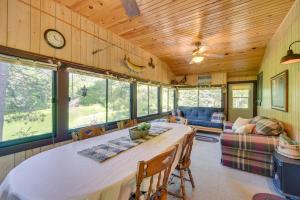 a dining room with a table and chairs in a house at Waterfront Cameron Retreat with Grill and Fire Pit! in Barron