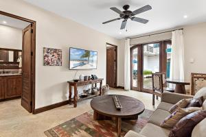 a living room with a couch and a ceiling fan at Casa Maya in Potrero