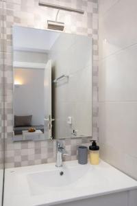 a bathroom with a sink and a mirror at Apelagitis 1 in Exámbela +25 photos