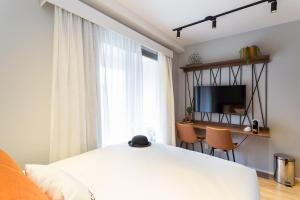 Cama ou camas em um quarto em Charlie Hotel Atmosfera Paulista