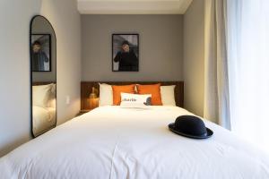 Cama ou camas em um quarto em Charlie Hotel Atmosfera Paulista