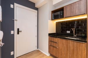 A cozinha ou cozinha compacta de Charlie Hotel Atmosfera Paulista