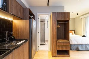 Cama ou camas em um quarto em Charlie Hotel Atmosfera Paulista