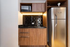 A cozinha ou cozinha compacta de Charlie Hotel Atmosfera Paulista