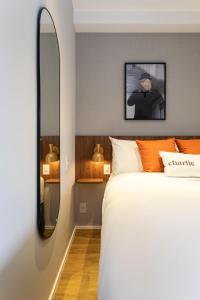 Cama ou camas em um quarto em Charlie Hotel Atmosfera Paulista