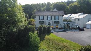 an aerial view of a house with a parking lot at Fernhill Hotel in Lyme Regis