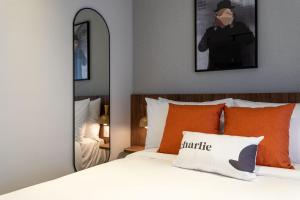 Cama ou camas em um quarto em Charlie Hotel Atmosfera Paulista