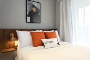 Cama ou camas em um quarto em Charlie Hotel Atmosfera Paulista
