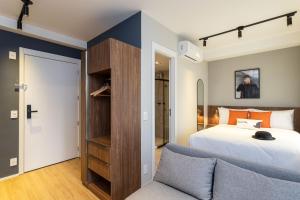 Cama ou camas em um quarto em Charlie Hotel Atmosfera Paulista
