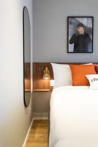 Cama ou camas em um quarto em Charlie Hotel Atmosfera Paulista
