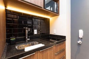 A cozinha ou cozinha compacta de Charlie Hotel Atmosfera Paulista