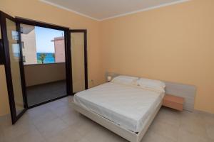 Postel nebo postele na pokoji v ubytování Chiaro di Luna Guest House