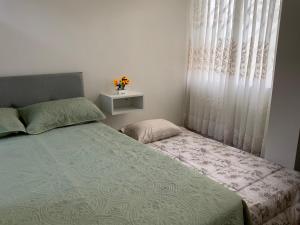 a bedroom with a bed and a window at MODERN HOUSE full apartment-planta baja in Lima
