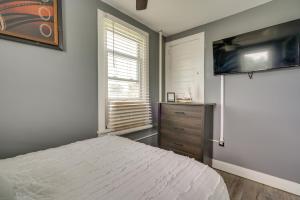 a bedroom with a bed and a flat screen tv at Atlantic City Getaway Near Casinos and Boardwalk! in Atlantic City