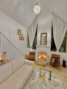 a living room with a couch and a fireplace at Holly House in Chachapoyas +20 photos