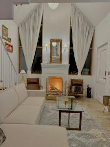 a living room with a couch and a fireplace at Holly House in Chachapoyas