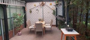 a table and chairs sitting on a patio at Apartment Popp Langen in Langen