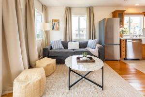 a living room with a couch and a table at Stylish Guest House with Ocean & City Views in San Diego