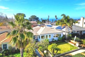 an aerial view of a house with palm trees at Stylish Guest House with Ocean & City Views in San Diego