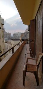 a bench sitting on the ledge of a balcony at Spacious Panthouse Center of Cairo exotic location in Cairo