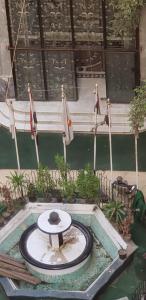 a fountain in the middle of a pool of water at Spacious Panthouse Center of Cairo exotic location in Cairo