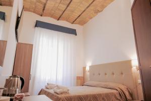 Postel nebo postele na pokoji v ubytování Hotel Alex Square