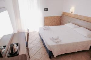 Postel nebo postele na pokoji v ubytování Hotel Alex Square