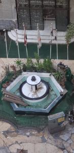 a fountain in the middle of a building at Spacious Panthouse Center of Cairo exotic location in Cairo